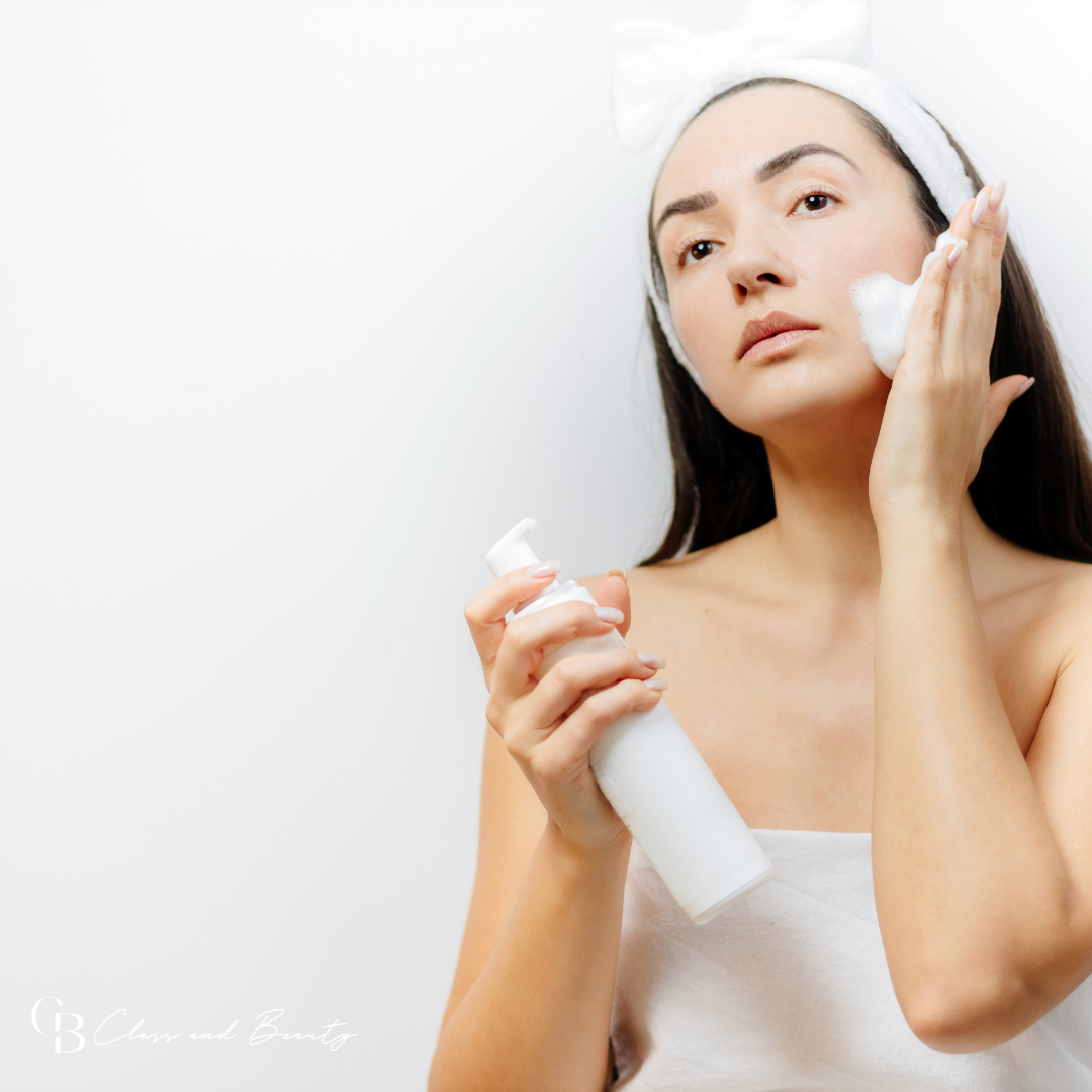 Woman applying skincare product, focusing on steps to repair the skin barrier.