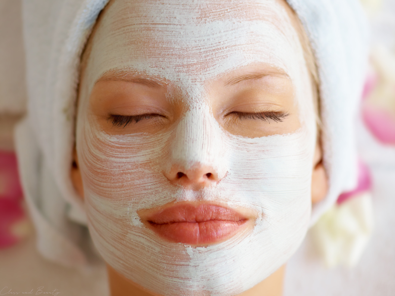 Woman applying a face mask as part of her skincare routine