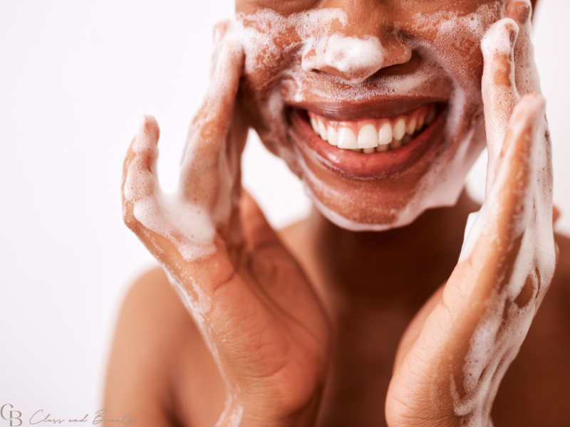 Woman washing her face as the first step in a skincare routine